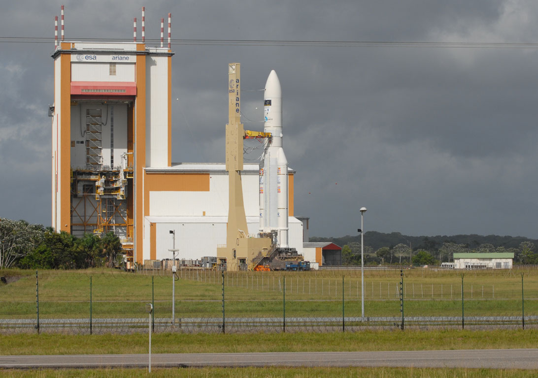 Roll-out of the launcher for the Herschel-Planck mission on 13 May 2009 with the dark, threatening storm clouds visible behind.